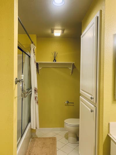 A spacious master bedroom with a private bathroom Main Photo