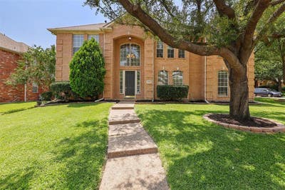 Classic Plano brick home with large fenced yard on Main Photo
