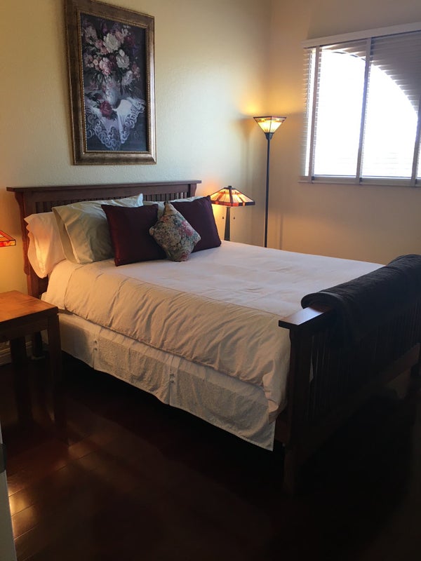 Photo 1: This is a queen size bed and extra room for a bigger bed or dressers.