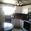 Photo 4: Italian tile backsplash marble table in large eat in kitchen w/ dishwasher and small laundry room