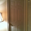 Photo 4: Door to the room off entry hall, mud room