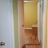Photo 3: Hallway with 2 closets and small bedroom at the end.
