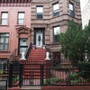 Photo 5: The brownstone with the two white lion head