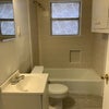 Photo 9: Shared full bath with ceramic tile and new flooring 