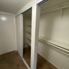 Photo 6: Selves inside closet.