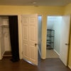 Photo 9: One regular closet (left) and one walk-in understairs closet (right)