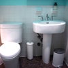 Photo 2: Shared bathroom with shower in tub