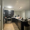 Photo 4: Large kitchen w/ stainless steel appliances