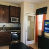 Photo 7: Kitchenette has 2 burner induction.  Brand new washer & dryer in the space.