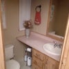 Photo 8: Roomates 1/2 bath.  Includes medicine cabinet