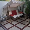 Photo 7: Swing chair on the patio