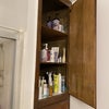 Photo 7: Deep three shelf cabinet would be all yours in the bathroom 