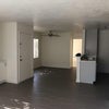 Photo 2: View of the door, dining room, and part of the kitchen area from the living room