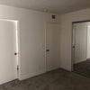 Photo 6: Closed door is the entrance door, slightly open door is the bathroom entrance.