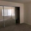 Photo 8: Partially open closet door in the bedroom for rent