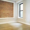 Photo 1: 90 SF middle room with exposed brick
