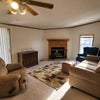 Photo 2: Spacious den w/ fireplace