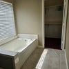 Photo 8: garden tub and walk-in closet