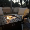 Photo 3: outdoor fireplace table and lounging chairs