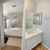 Photo 5: 2 sinks with medicine cabinet, cupboards...