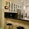 Photo 4: Remodeled kitchen with stainless appliances, granite counter, breakfast bar