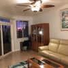 Photo 3: Gorgeous sunsets from beachfront living room with a  clean fireplace