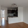 Photo 7: (unfurnished) living room + kitchen