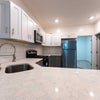 Photo 7: Shared kitchen with quartz countertops