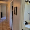 Photo 8: Looking from front bedroom down hallway to back bedroom.