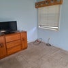 Photo 2: Extra room with tv and dresser.