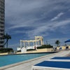 Photo 9: Huge pool deck with raised jacuzzi and Olympic pool