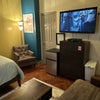 Photo 2: This room is complete with a full size bed, a futon that opens to a full-size bed mini refrigerator 
