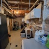 Photo 9: Unfinished Basement (washer/dryer/storage)