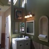 Photo 4: this room's  sink is tall- warm lightning throughout