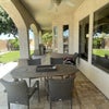 Photo 7: large patio with BBQ and dinning/patio table 