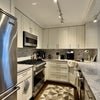 Photo 6: Fully-stocked kitchen