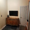 Photo 7: Dresser and TV