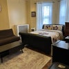Photo 1: Queen size bed mini fridge 50 inch TV and a full-size that opens to a full size bed 