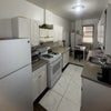 Photo 2: access to kitchen and dining room