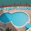 Photo 9: Pool and Tikki Huts on the bay