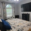 Photo 6: Blue bedroom has private sink and closet with shared toilet and tub.$800 month
