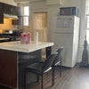 Photo 2: Open kitchen &  island. Two refrigerators. 