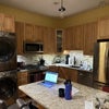 Photo 2: Eat-in Kitchen with washe/dryer.