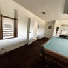 Photo 2: Shared game room (pool and darts)