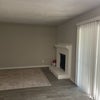Photo 4: shared living room, fireplace and sliding doors to patio