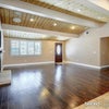 Photo 5: Living Area (we’ve got a huge couch and TV already set up)