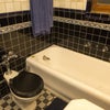 Photo 4: Large tub in fully tiled bathroom.