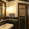Photo 5: Fully tiled bathroom with unique round shower.