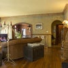 Photo 8: High ceilinged living room with hardwood floors. 