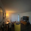 Photo 4: A quick snip of the living room! We're open to more furniture 